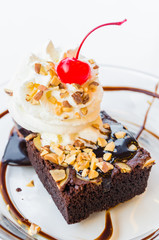 Chocolate brownie icecream and cherry