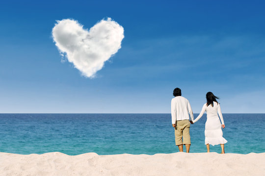 Couple enjoying honeymoon at white sand beach