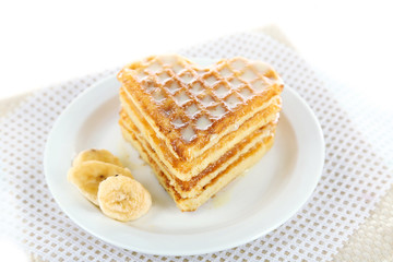 Sweet Belgium waffles with banana, isolated on white