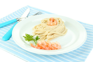 Pasta with shrimps on white plate, isolated on white