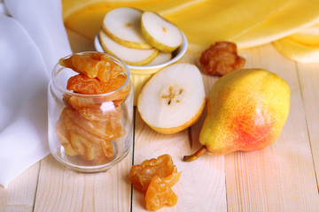 Dried pears on wooden background