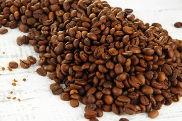 Coffee beans on wooden background