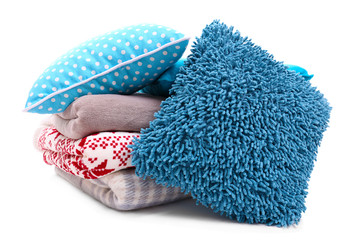 Colorful pillows and plaids isolated on white