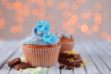 Tasty cupcakes with butter cream,