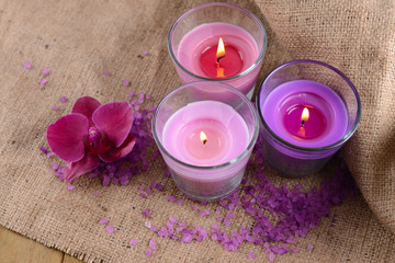 Composition with beautiful colorful candles, sea salt and