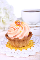 Tasty cake on table on light background