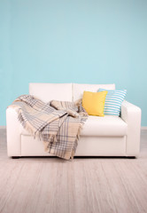 White sofa in room on blue background