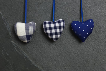 White Blue pattern Love Valentine's hearts hanging on grey slate