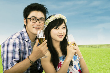 Young couple drinks wine