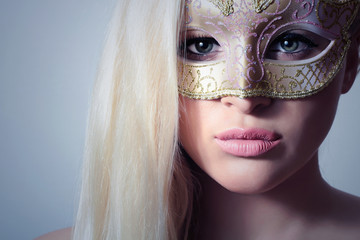 Beautiful Blond Woman in a Carnival Mask.Masquerade.Sexy Girl
