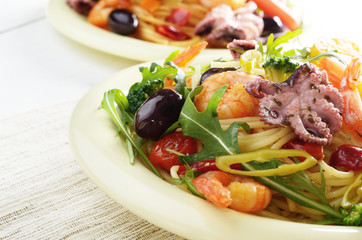 Seafood spaghetti pasta dish with octopus and shrimps