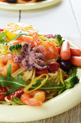 Seafood spaghetti pasta dish with octopus and shrimps