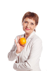 attractive woman 50 with orange in hand