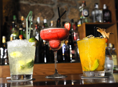 varied colorful cocktails, gin and tonic, mojito, and daikiri