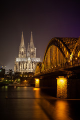 Fototapeta premium Bridge and the Dom of Cologne at night. Cologne, Germany