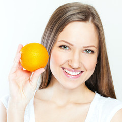 Portrait of a young beautiful woman with orange