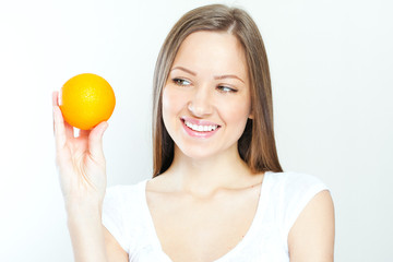 Portrait of a young beautiful woman with orange