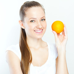 Portrait of a young beautiful woman with orange