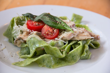 Italian pasta with  spinach and tomatoes