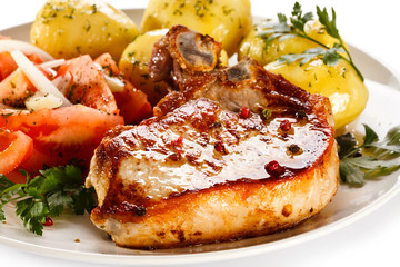 Grilled steak, boiled potatoes and vegetable salad