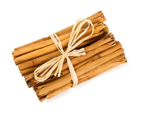 ceylon cinnamon sticks tied up on white background