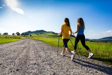 Papier Peint photo Jogging Nordic walking - active people working out outdoor