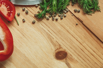 Wood background with dill and pepper frame