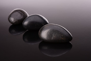 Spa stone arrangement on black surface