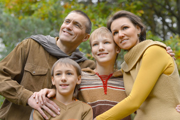 Happy family in the autumn park