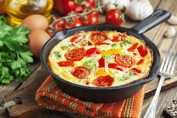 Omelet with vegetables and cheese. Frittata