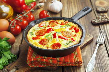 Omelet with vegetables and cheese. Frittata - 60711161