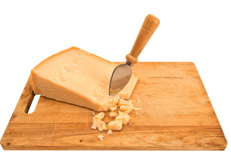 Parmesan cheese with knife on old wooden board, isolated over wh