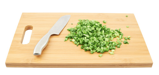Cut in pieces green onion over cutting board