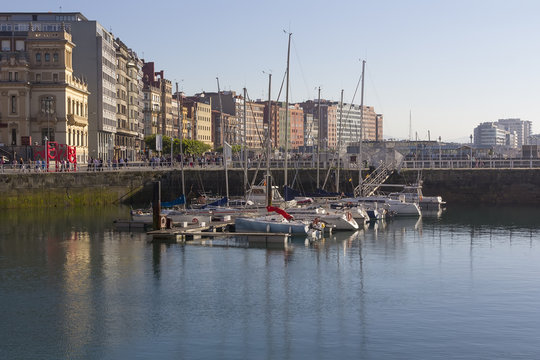 small marina with calm sea in the city of Gijon, Spain
