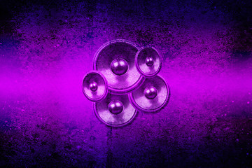 Purple music speakers on a concrete wall