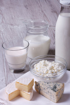 set of products brie, blue cheese, cottage cheese and milk