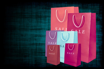 Shopping sale bags on grange background.