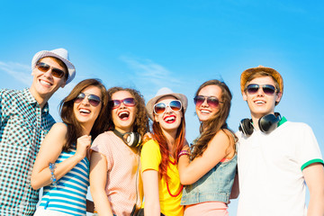 group of young people wearing sunglasses and hat