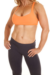 Fototapeta na wymiar Woman orange bra hands hips body