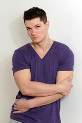 portrait young man wearing purple shirt