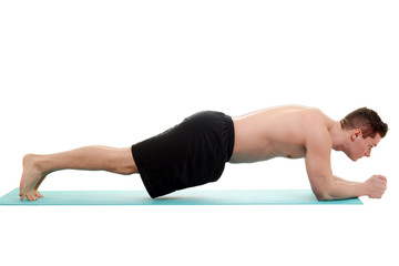 young man doing planking exercise
