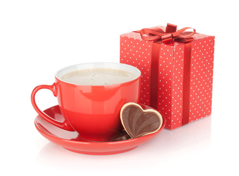 Red coffee cup, chocolate cookie and gift box