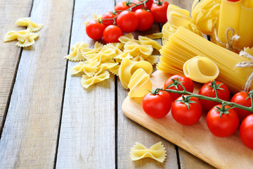 uncooked pasta and cherry tomatoes branch
