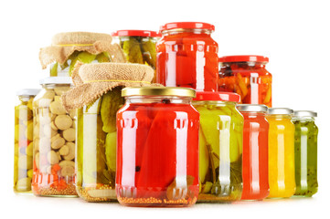 Composition with jars of pickled vegetables. Marinated food