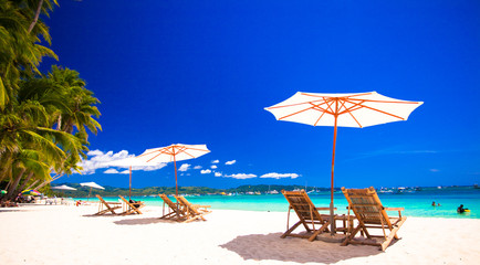 Obraz na płótnie Canvas Paradise view of nice tropical empty sandy plage with umbrella
