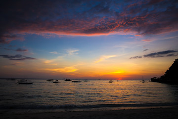 Fototapeta na wymiar Colorful bright sunset on the island Boracay, Philippines