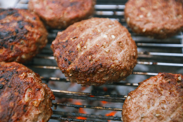 food meat - beef burgers on bbq  barbecue grill with flame