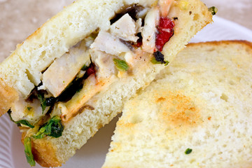 Close view of chicken sandwich cut in half