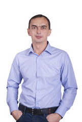 Fototapeta premium Young man with hands in pocket, isolated on white background