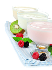 Delicious yogurt with fruit and  berries isolated on white